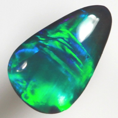 SOLID BLACK OPAL Neon bright green in a Broad Rolling flash